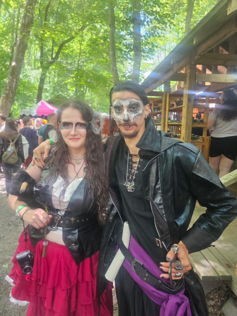 My boyfriend and I at the Virginia Renaissance Faire, dressed as pirates with freshly painted faces—capturing a fun and playful moment from our cosplay adventure.