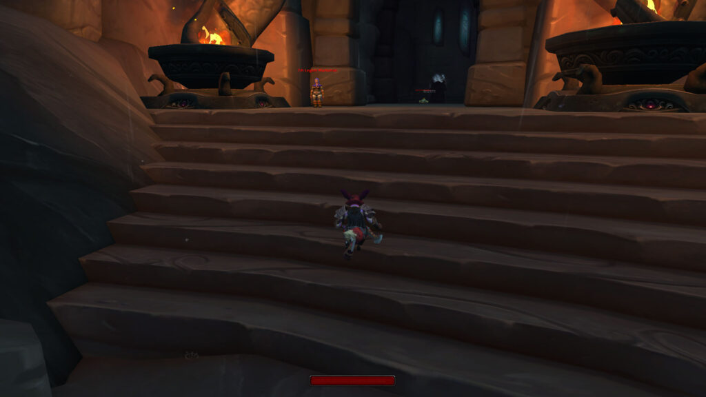 Mindful gaming moment: a Vulpera rogue running upstairs, embracing the grind with focus and intention